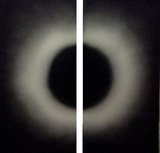 <Sun meeting the moon in a corner or half cut black circle and half cut white circle in darkness , 2016